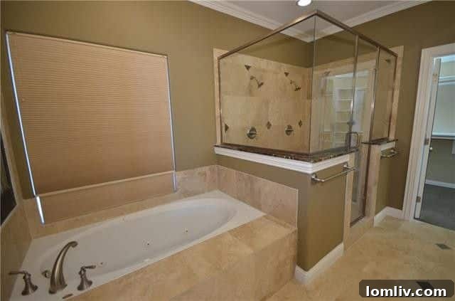 Stylish built-in bar with wine fridge, perfect for entertaining in this luxury Dallas residence.