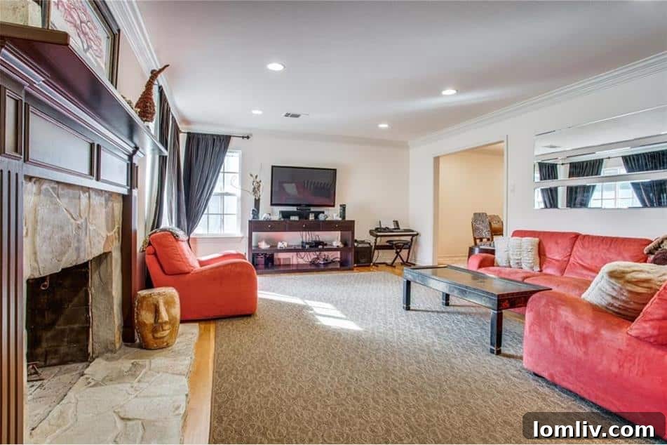 Bright and spacious living area with abundant natural light in a Caruth Hills home