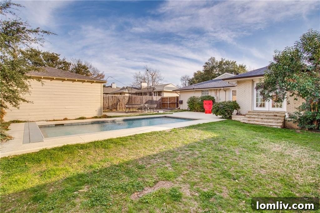 Elegant master bathroom featuring travertine floors, a frameless glass shower, and vessel glass sinks