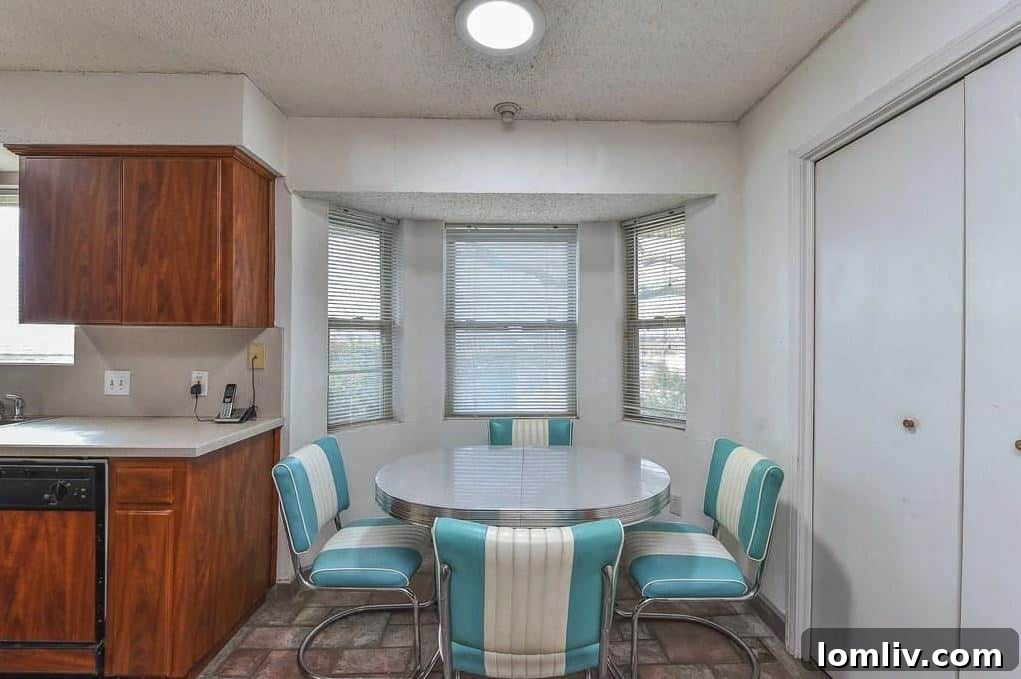 Before renovation breakfast nook area with older decor