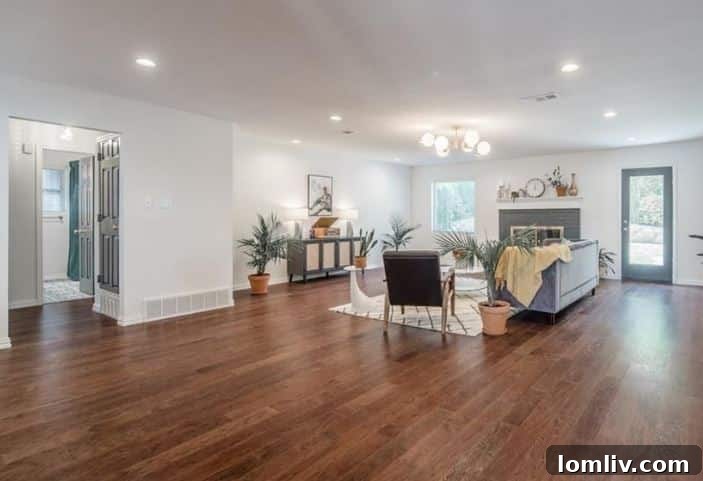 After renovation spacious living room with modern decor and fireplace