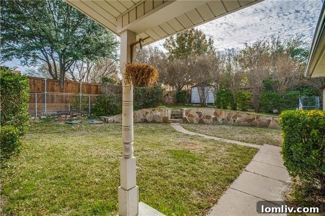 Private corner lot with mature landscaping and storage shed