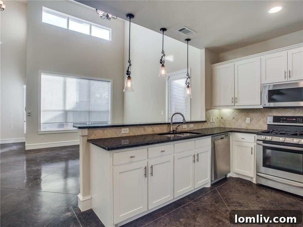 Open-concept living area with double-height ceilings and concrete floors