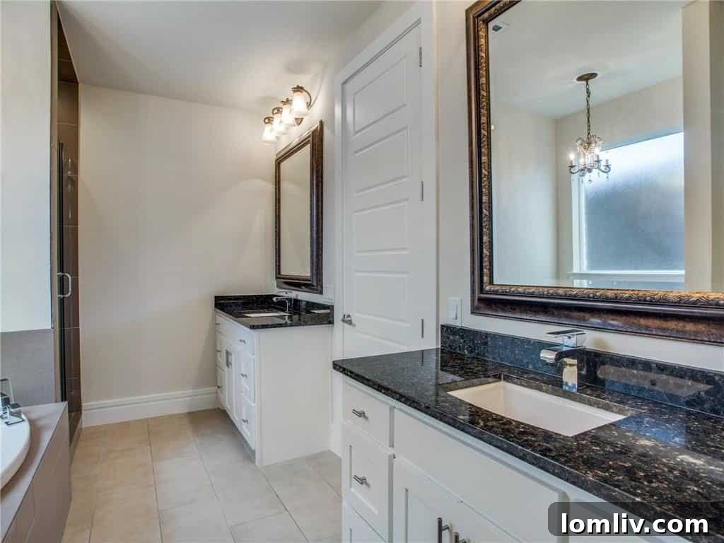 Luxurious master bathroom with double vanities, separate tub and shower
