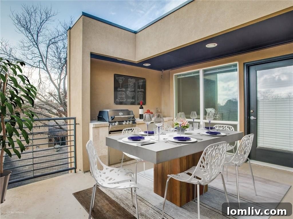 Outdoor terrace with kitchen on the third level, overlooking Fort Worth