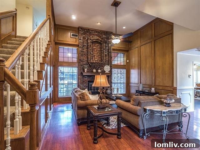 Interior view of the spacious living area with vaulted ceilings and a brick fireplace at 829 Shady Lake Drive, Bedford.