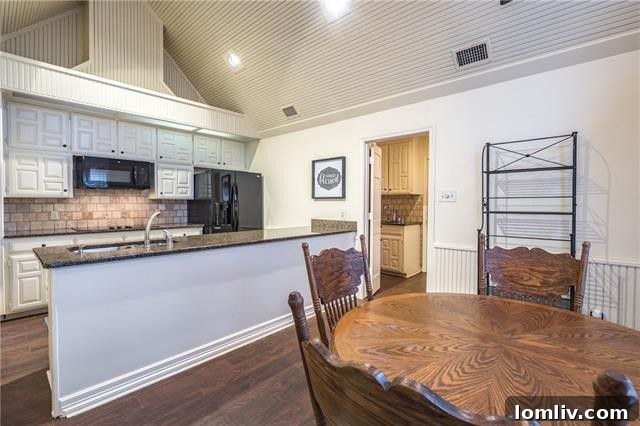 Comfortable family room with ample natural light next to the spa room at 829 Shady Lake Drive, Bedford.