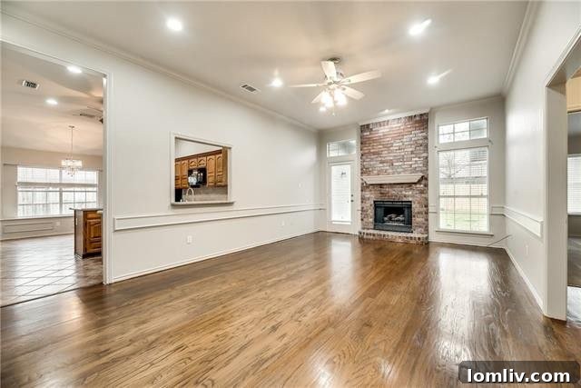 Bright and spacious living room with vaulted ceilings and new carpet at 2520 Classic Court W, Bedford.