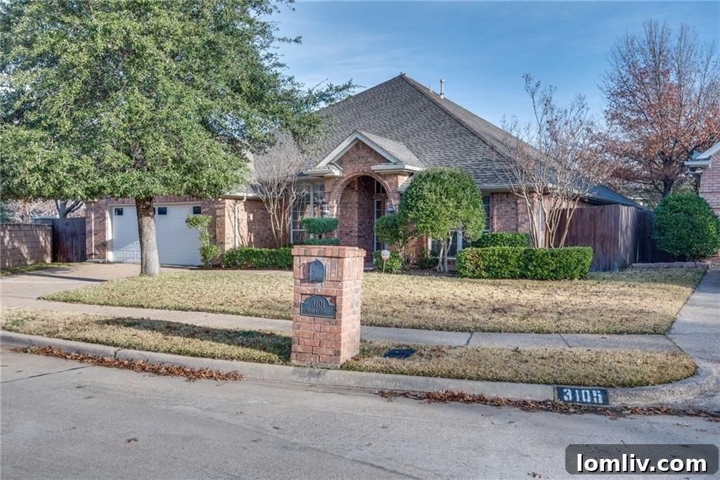 Elegant living room with hardwood floors and high ceilings at 3101 Andrew Court, Bedford, Texas.