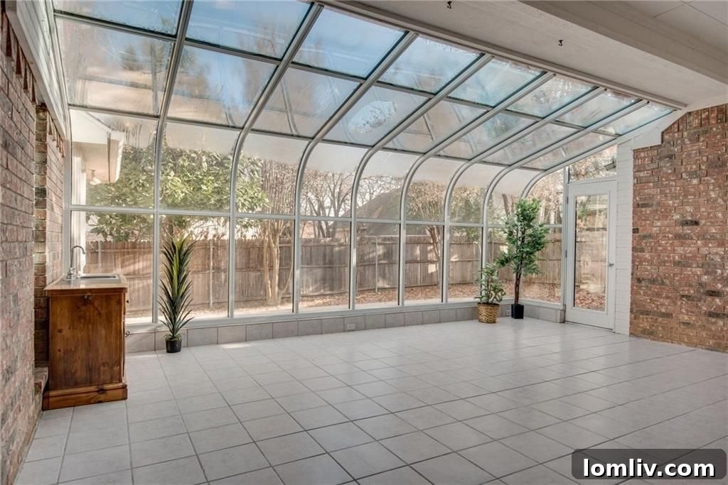 View of the well-maintained backyard from the sunroom at 3101 Andrew Court, Bedford.