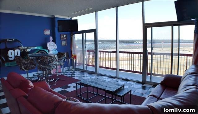 Texas Motor Speedway Twin 200 Tuesday Thunder 8 Living room of Unit 1, with a view of the track and racing-themed decor