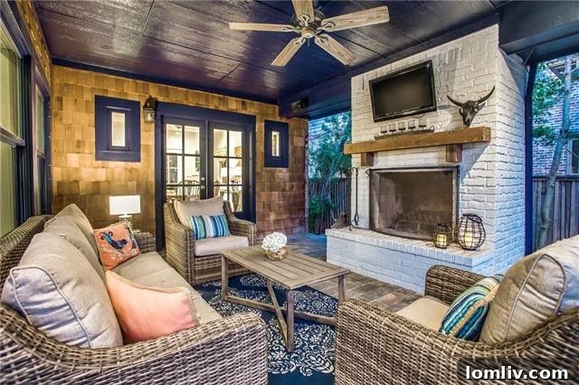 Stunning Outdoor Living Area with Fireplace and Blue Ceiling