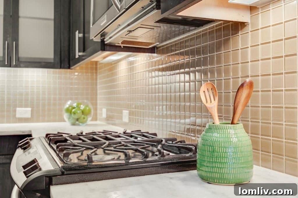Modern kitchen with a gas stove, perfect for preparing simple meals or entertaining.