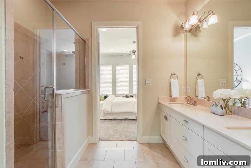 Spacious walk-in shower in one of the three bathrooms, offering luxury and comfort.