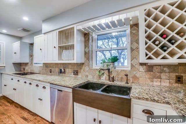 Well-designed kitchen with original cabinetry and modern touches at 10111 Champa Drive