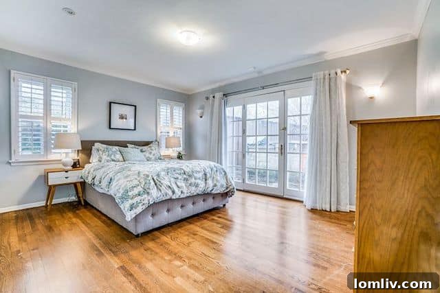 Spacious master bedroom with French door access at 10111 Champa Drive