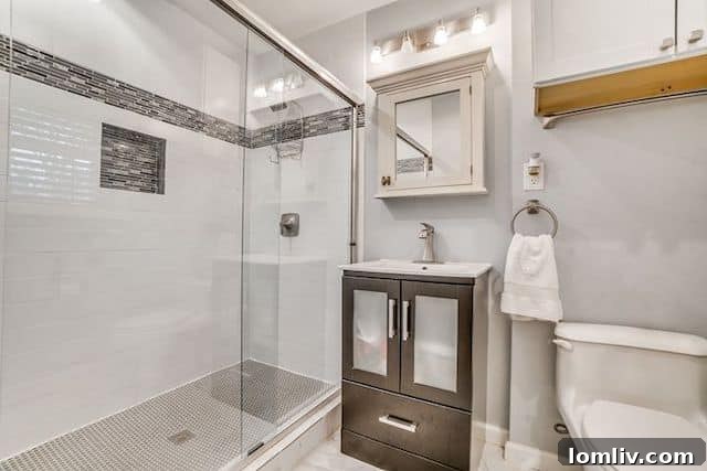 Luxurious master bathroom with expansive glass super shower and unique tile details