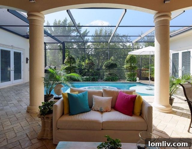 Dockside view of a charming Key Largo home with a boat lift, showcasing waterfront living