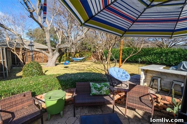 Designer en-suite master bathroom featuring contemporary fixtures, a spacious vanity, and elegant finishes.
