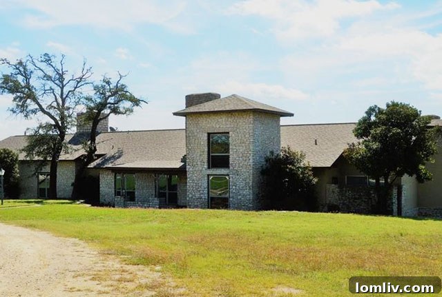Stunning aerial view of Spanish ranch home on vast Texas acreage