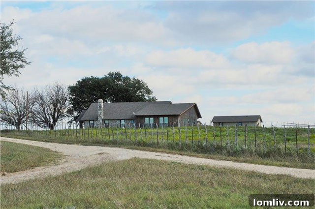 Interior view of spacious Spanish ranch living room with fireplace