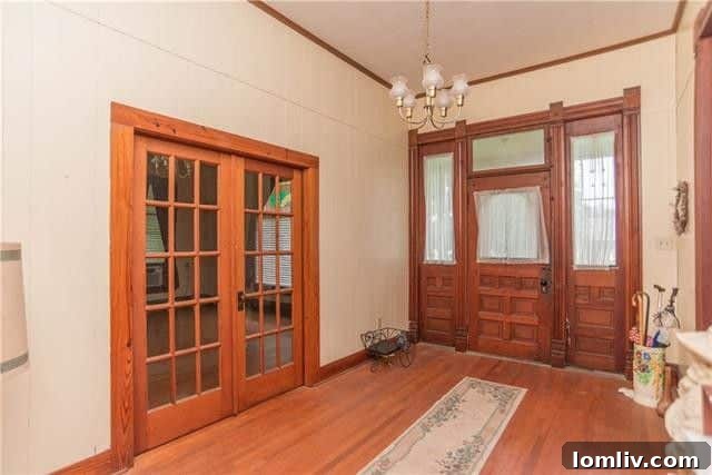 Front porch with intricate spindlework on historic Folk Victorian home