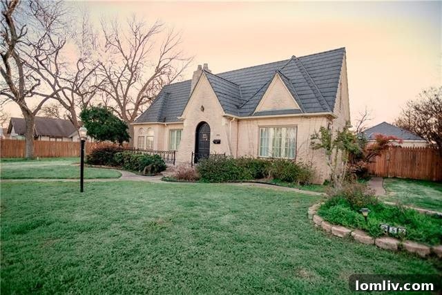 Classic brick Tudor home with mature trees in Dublin, Texas