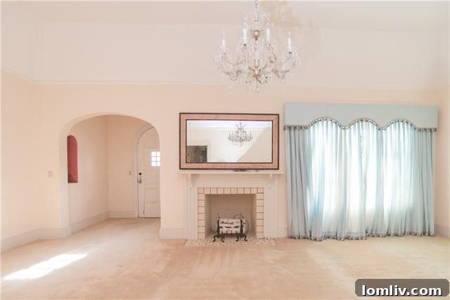 Cozy living room with fireplace in 1938 brick Tudor home