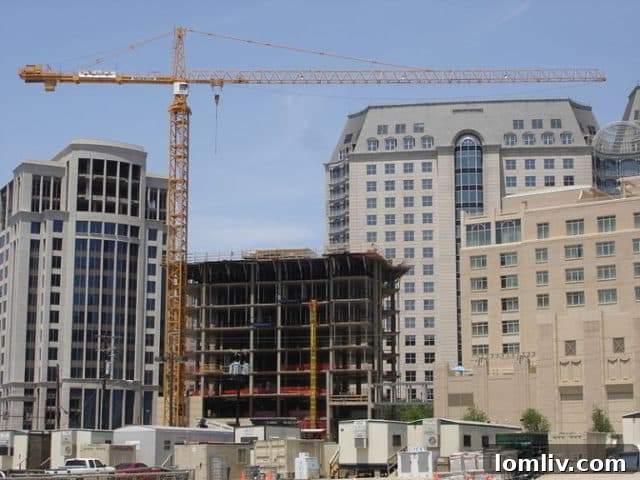 Tower crane over modern luxury apartments in an urban Dallas skyline