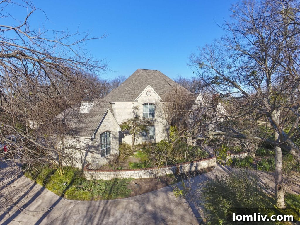 Lush front exterior of 140 Brookbend Drive in Waxahachie, showcasing mature trees and inviting entrance