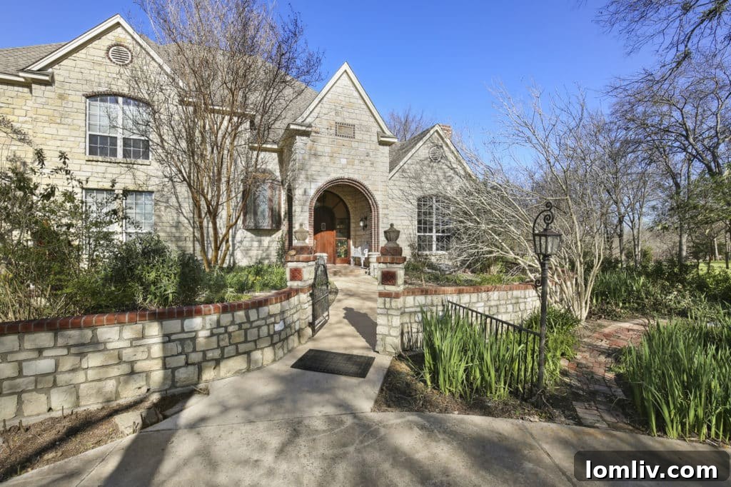 Lush English garden with intricate brick pathways and varied flora at 140 Brookbend Drive