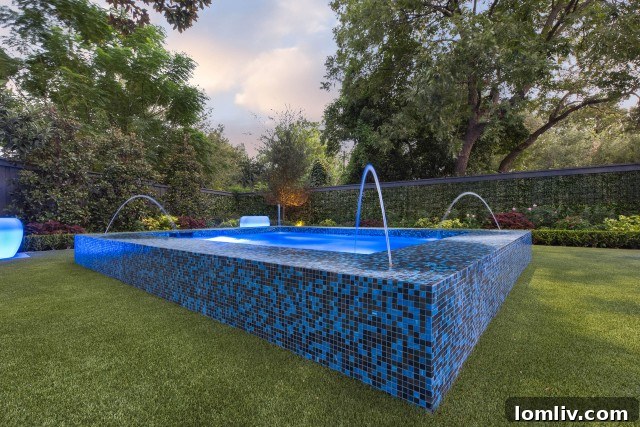 Beautifully Designed Backyard with Artificial Turf for Water Conservation