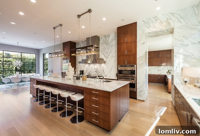 Large kitchen island with Magni Home Collection pendant chandeliers and breakfast bar