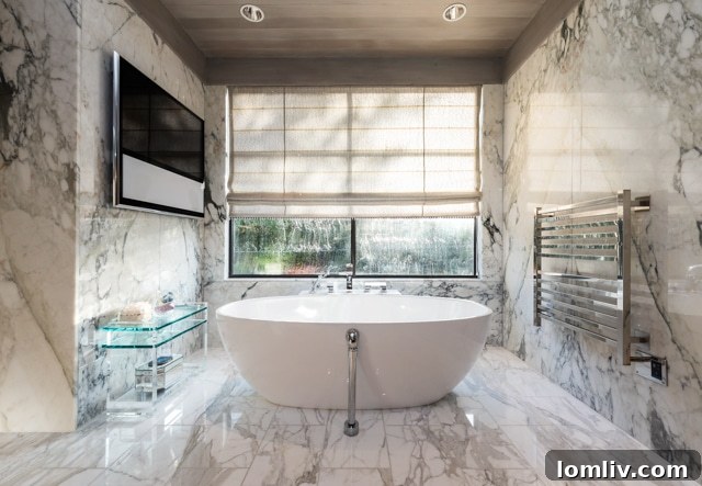 Luxurious master bathroom with soaking tub and steam shower