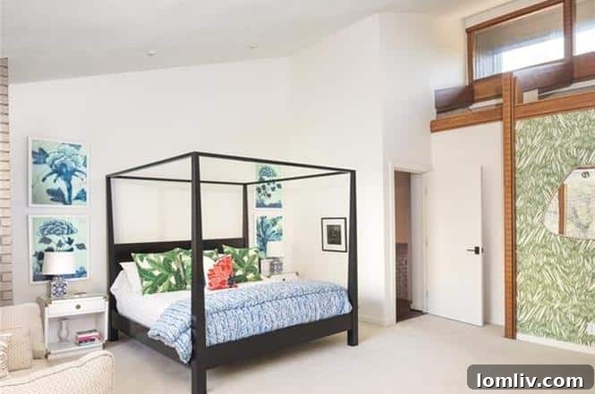 Spacious master bedroom with soaring ceilings, large windows, and a private balcony