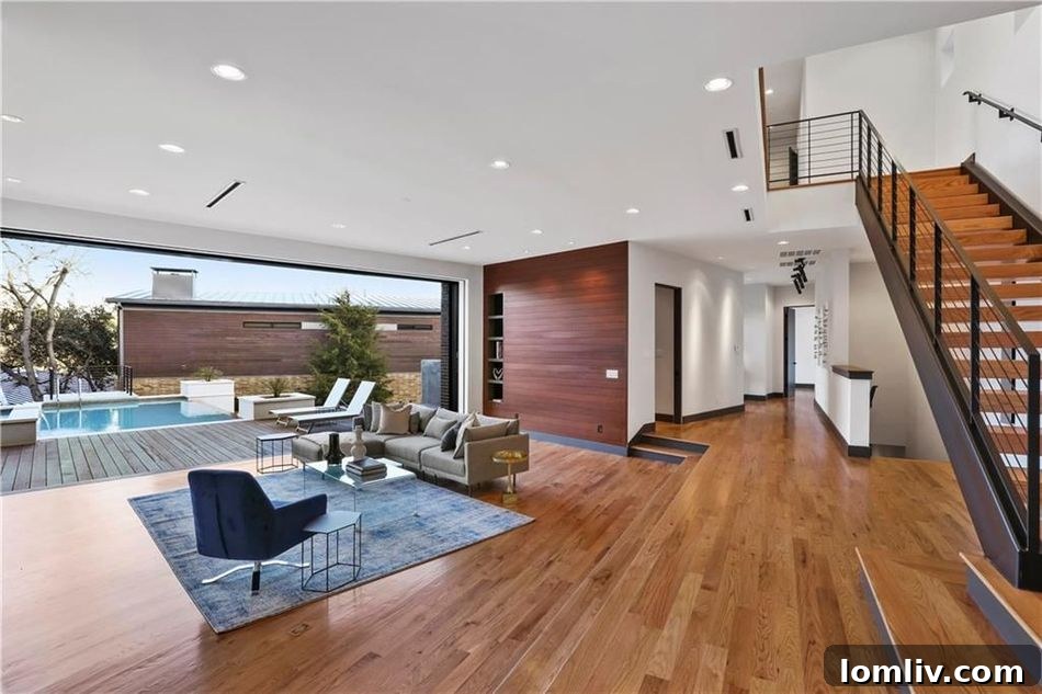 Open concept living room with disappearing glass walls