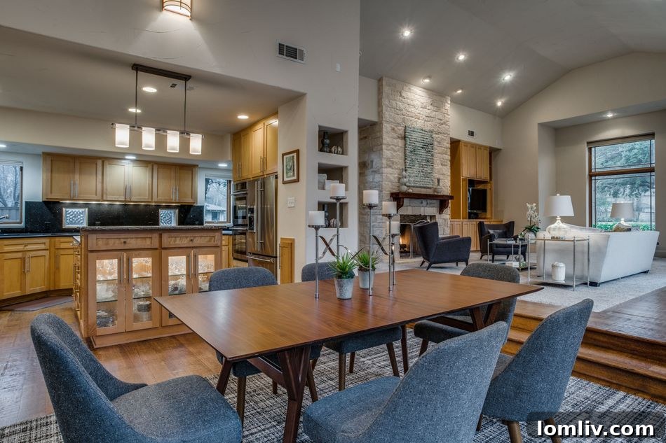 Modern kitchen with oversized granite island and stainless appliances