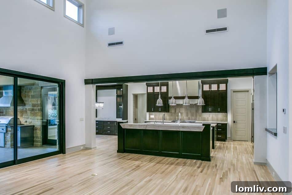 Gourmet kitchen with Wolf-Miele appliances and large center island