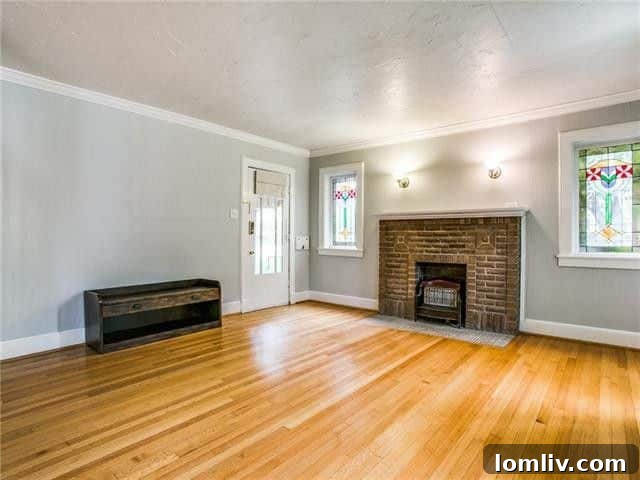 Hampton Hills: Oak Cliff's Premier Address 3 An inviting Hampton Hills home showcasing original Tudor and Craftsman architectural details, with a well-maintained lawn and classic design that reflects its historic charm.