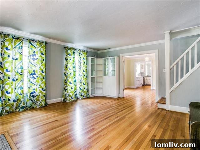 Hampton Hills: Oak Cliff's Premier Address 4 Close-up of a Hampton Hills home facade, highlighting the intricate brickwork, stone details, and charming storybook architectural elements characteristic of the neighborhood's early 20th-century construction.