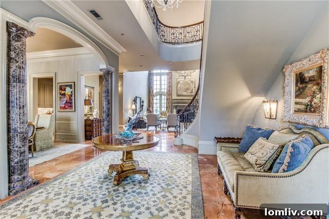 Stunning Foyer with Marble Floors and Grand Staircase