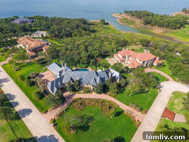 Aerial view of a sprawling luxury home with a pool and lake access in Flower Mound