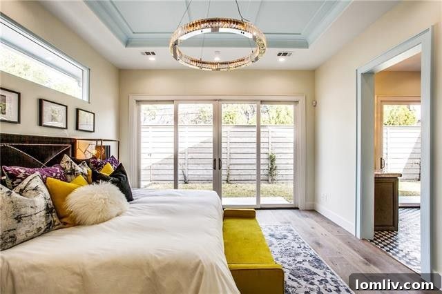 Luxurious master bathroom with freestanding soaking tub, large walk-in shower, and elegant tilework