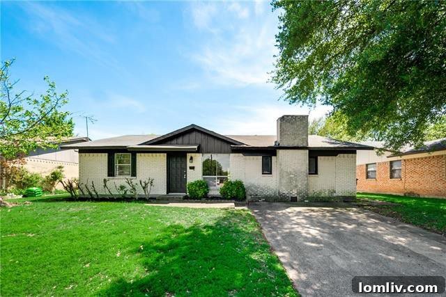 Front exterior of a charming four-bedroom home at 2402 Royal Dr. in Garland, TX