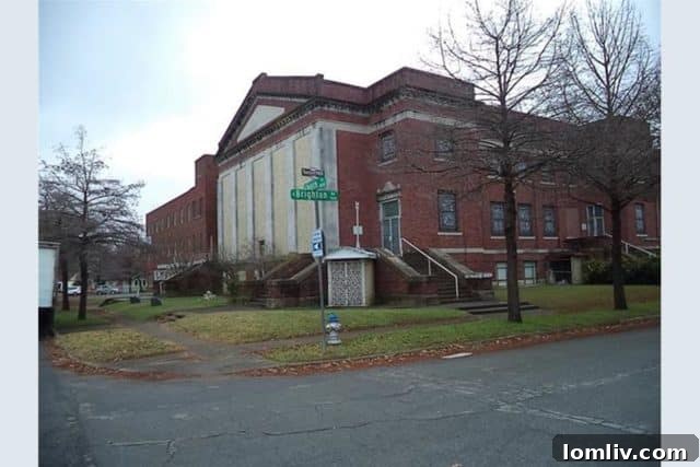 The grand facade of Calvary Baptist Church, a historic Oak Cliff landmark currently listed for sale.