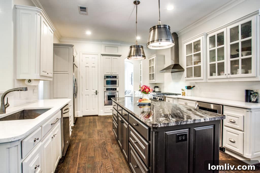Updated open concept kitchen with modern designs at 6654 Gascony Place