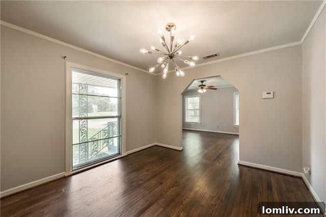 A view inside one of the three spacious bedrooms, featuring new, plush carpeting and a warm, inviting atmosphere, ideal for relaxation