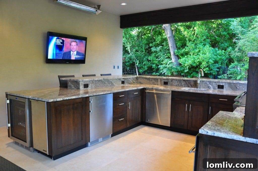 Beyond the Grill: Building Your Dream Outdoor Kitchen 2 Luxurious outdoor kitchen with built-in grill, spacious counter, and elegant cabinetry, surrounded by lush greenery.