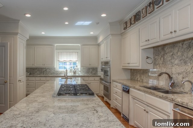 Gourmet kitchen at 6158 Indian Creek Drive featuring Viking, Thermador, and Sub-Zero appliances, a silver closet, and coffee bar.