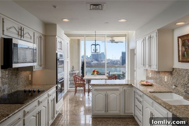 Turtle Creek Chic: The Condo That Will Convert You to Apartment Living 5 Sophisticated dining space with modern chandelier in a high-rise residence